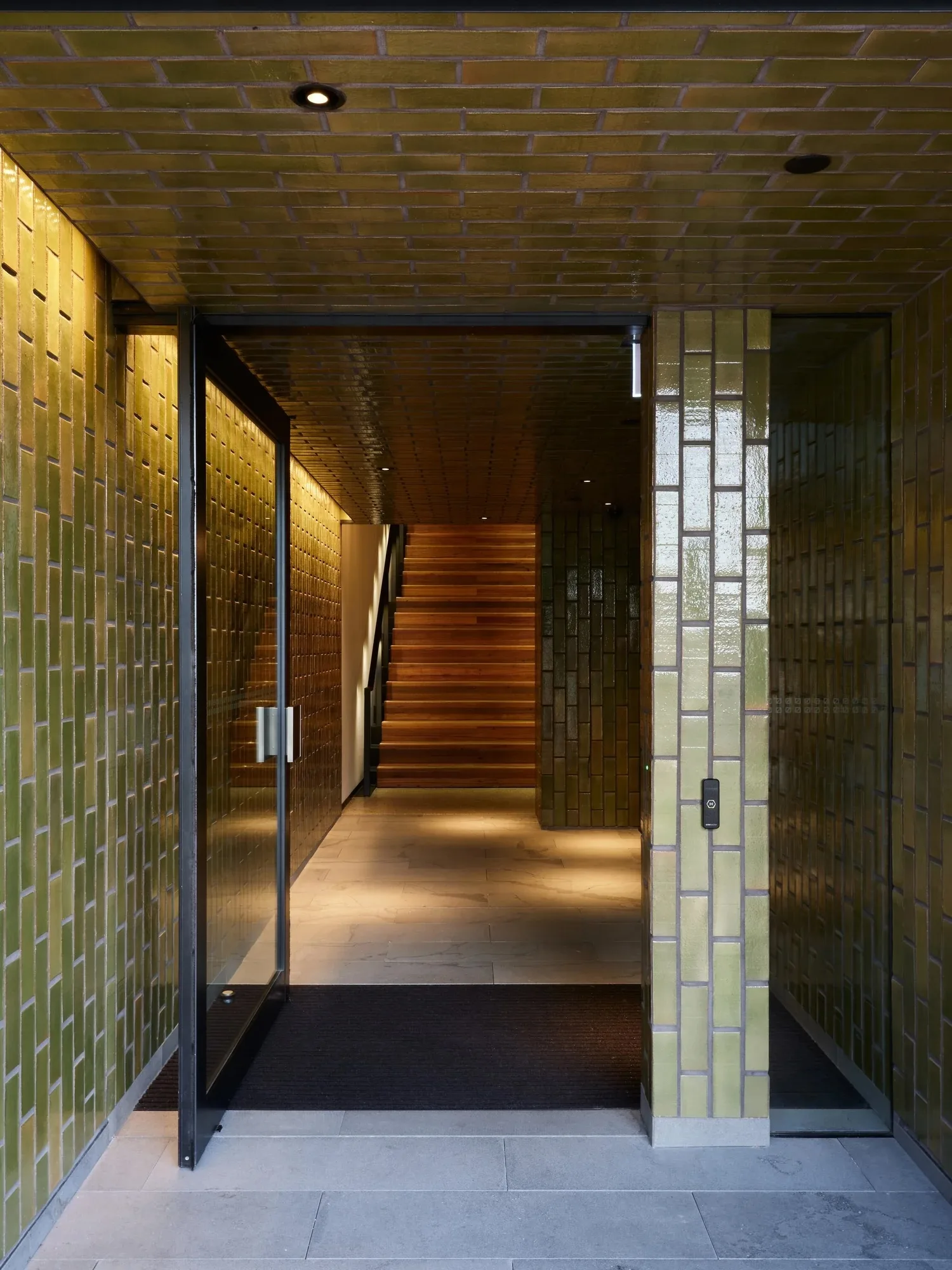 The tiled entrance corridor at 200 High Street, with the stairs at the far end.